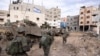 FILE - Israeli soldiers take part in a ground operation in Gaza City's Shijaiyah neighborhood, Dec. 8, 2023.