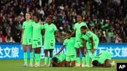 Nigeria's players react during a penalty shootout during the Women's World Cup round of 16 soccer match between England and Nigeria in Brisbane, Australia, Aug. 7, 2023.