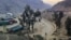 FILE - Trucks loaded with goods are seen parked at border crossing point Torkham in Afghanistan's eastern Nangarhar province, on the country's border with Pakistan, Feb. 21, 2023. Pakistani authorities closed the crossing on Sept. 6, 2023.