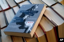 FILE - This photo shows the book "Thirteen Reasons Why" in a photo illustration Monday, May 15, 2017, in Phoenix. (AP Photo/Ross D. Franklin)