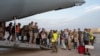 French and other nationalities disembark at a French military air base in Djibouti, April 23, during their evacuation from Sudan on the first French flight out of the war-hit country.
