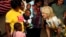 U.S. first lady Jill Biden, right, smiles at children during a visit to a U.S. President's Emergency Plan for AIDS Relief project at an informal settlement near Windhoek, Namibia, Feb. 23, 2023.