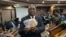 John Mushayavanhu, the new governor or the Reserve Bank of Zimbabwe, displays new banknotes of the country's currency to reporters, in Harare, April 5, 2024. (Columbus Mavhunga/VOA)