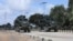FILE - Somalia National Army (SNA) soldiers ride on an armored personnel carriers during a parade in Mogadishu, April 12, 2022.