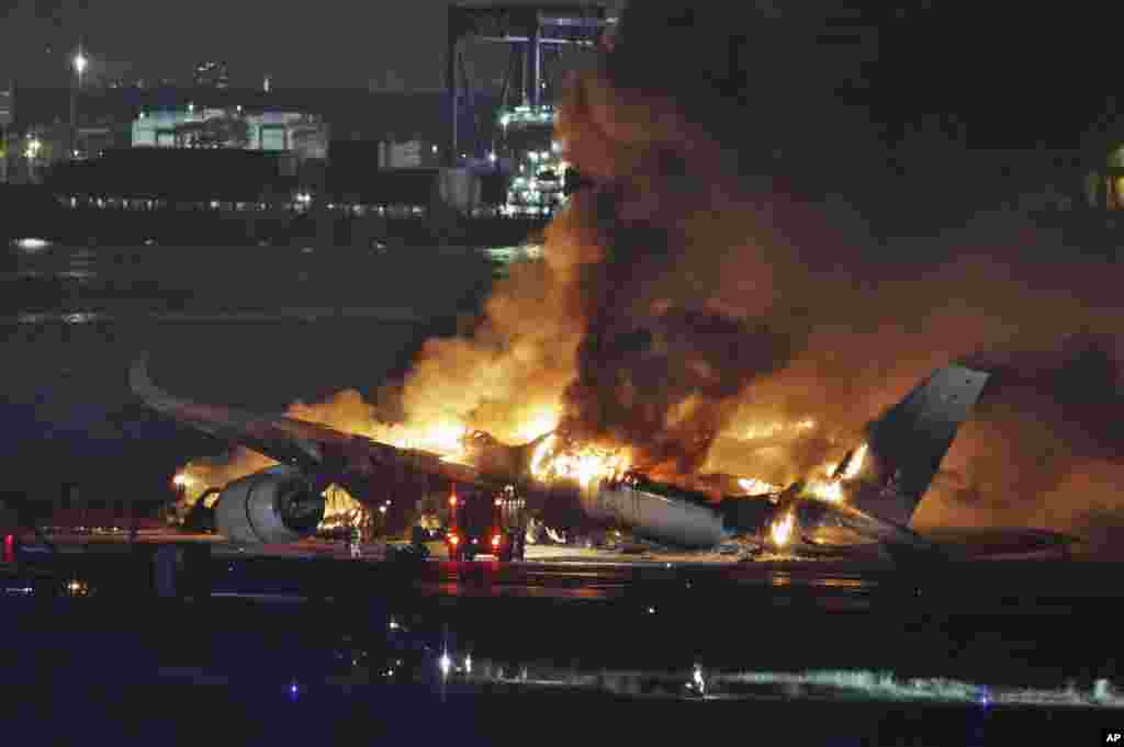 A Japan Airlines plane is on fire on the runway of Haneda airport, Jan. 2, 2024 in Tokyo, Japan.