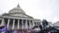 FILE - Rioters loyal to US President Donald Trump swarm the US Capitol in Washington, Jan. 6, 2021. 