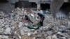 Palestinians recover the bodies of the al Meghari family killed in the Israeli bombardment of the Gaza Strip in Bureij refugee camp, Gaza Strip, Nov. 14, 2023.
