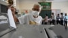 A man casts his vote at a polling station in Phnom Penh on July 23, 2023 during the general elections. (Photo by TANG CHHIN SOTHY / AFP)