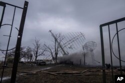 FILE - Smoke rises from an air defense base in the aftermath of an apparent Russian strike in Mariupol, Ukraine, Thursday, Feb. 24, 2022. (AP Photo/Evgeniy Maloletka, File)