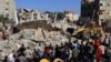 Palestinian rescuers look for survivors as others watch a digger remove concrete blocks after an Israeli strike on Rafah, in the southern Gaza Strip on Nov. 9, 2023.