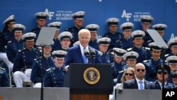 President Joe Biden gives a smile during the U.S. Air Force Academy graduation ceremony, June 1, 2023, at Air Force Academy, Colo.
