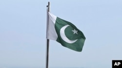 FILE - A Pakistani flag flies at a lookout in Islamabad, Pakistan, on July 27, 2022. Pakistan has condemned Germany's 'failure' to safeguard its consulate in Frankfurt from being stormed and vandalized by protesters reportedly carrying Afghanistan's national flag.