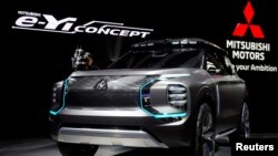 资料照：上海汽车展上的日产汽车展台 （2019年4月16日）