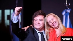 Argentine president-elect Javier Milei and his sister Karina Milei react to the results of the runoff presidential election, in Buenos Aires, Nov. 19, 2023. (REUTERS/Agustin Marcarian)