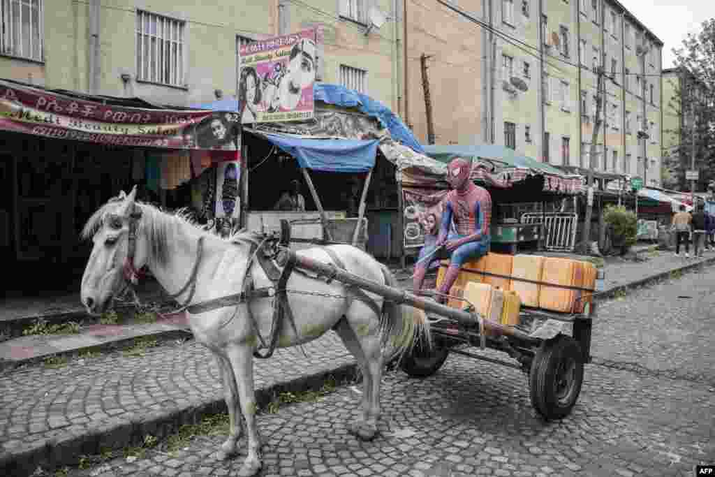 A man dressed in a Spiderman costume and known as Ethio-Spiderman sits on a horse cart in Addis Ababa, Ethiopia, Aug. 12, 2024. 