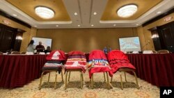 FILE - Members of the US government's Not Invisible Commission prepare for a field hearing in Albuquerque, NM, June 28, 2023.