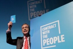 Nigel Farage, Leader of Britain's Brexit Party poses after speaking on stage at the launch of their policies for the General Election campaign, in London, Nov. 22, 2019.