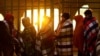 FILE - Venezuelan migrants, some expelled from the U.S. to Mexico under Title 42, queue outside of the National Migration Institute to process a permit to stay in Mexico for 180 days, in Ciudad Juarez, Mexico, Oct. 24, 2022. 