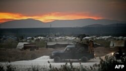 Dimeneke endamên koma cîhadî ya Heyet Tehrîr el-Şam (HTS) li herêma Efrînê, 12 Cotmeh 2022.