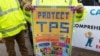 FILE - Demonstrators participate in the March for TPS (Temporary Protected Status) Justice in support of permanent residency, outside the White House, in Washington, Feb. 12, 2019. 