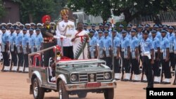 India's newly elected President Droupadi Murmu inspects guard of honor after taking her oath in New Delhi, July 25, 2022.