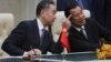 FILE - Chinese Foreign Minister Wang Yi, left, talks with Cambodian Prime Minister Hun Sen as they sit to witness a signing ceremony for a free trade agreement at Peace Palace in Phnom Penh, Cambodia, Monday, Oct. 12, 2020. (AP Photo/Heng Sinith)