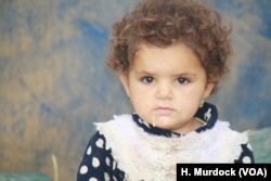 Parents say children of IS fighters are often unaware of their fathers' crimes, but face hostility from neighbors and other IS victims as they mourn, in Ninewa province, Iraq, March 8, 2018.