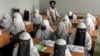 FILE - Afghan girls attend a religious school, which remained open since the Taliban's takeover more than two years ago, in Kabul, Afghanistan, Aug 11, 2022.
