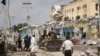 FILE - Police and military officials comb the scene of an al-Shabab group militant attack in Mogadishu, Aug. 21, 2022.