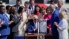 President Joe Biden holds the "CHIPS and Science Act of 2022" after signing it during a ceremony on the South Lawn of the White House, in Washington, Aug. 9, 2022.