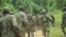 Wanajeshi wa Uganda wakionekana kwenye barabara ya Mbau-Kamango wilayani Beni, Disemba 8, 202, kuwasaka waasi wa ADF. Picha ya AFP