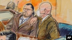 This artist sketch depicts Guy Wesley Reffitt, joined by his lawyer William Welch, right, in Federal Court, in Washington, Monday, Feb. 28, 2022. Reffitt, a Texas man charged with storming the U.S. Capitol with a holstered handgun on his waist, is the fir