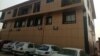Cars are parked in front of media conglomerate Vision Media Services Limited in Jabi, Nigeria. (Timothy Obiezu/VOA)