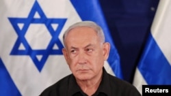 资料图片:2023年10月28日以色列总理内塔尼亚胡在特拉维夫举行新闻发布会。（路透社）