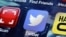 FILE - A Twitter app on an iPhone screen is shown.