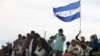 Migrants participate in a binational Mass in memory of migrants who have died trying to cross the border between Mexico and the US in Ciudad Juarez, Mexico, Nov. 5, 2022. 