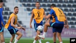 England's Harry Kane, middle, takes part in drills during an official training session on the eve of the quarterfinal World Cup soccer match between France and England, at Al Wakrah Sports Complex, in Al Wakrah, Qatar, Friday, Dec. 9, 2022. 