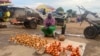 People sell produce in Zimbabwe in this undated photo. Zimbabwe's economy has mainly turned informal over the years, and authorities attribute that to sanctions imposed by some Western nations following reports of election rigging and human rights abuses. (Columbus Mavhunga/VOA)