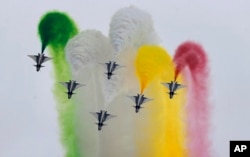 FILE - Chinese J-10 fighter jets demonstrate an aerobatic performance during a military parade to mark Pakistan National Day, in Islamabad, Pakistan, March 23, 2019.