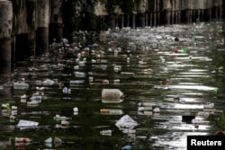 FILE - Plastic bottles float on the heavily polluted San Juan River, a tributary of Pasig River in Mandaluyong City, Philippines, June 21, 2021. (REUTERS/Eloisa Lopez/File Photo)