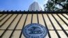 FILE - The logo of the Reserve Bank of India (RBI) is pictured on the gate of the bank's head office in Mumbai, Nov. 17, 2021.