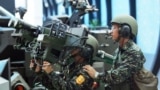 FILE - Soldiers from Taiwan demonstrate a US-made dual mount Stinger missile system Aug. 11, 2005.