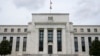 FILE - This May 4, 2021, file photo shows the Federal Reserve building in Washington.