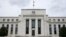 FILE - This May 4, 2021, file photo shows the Federal Reserve building in Washington.
