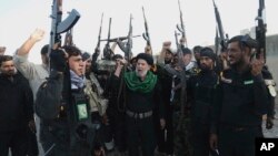 اعضای یکی از گروه های شبه نظامی شیعه در عراق که در جریان جنگ با داعش کمک نیروی قدس سپاه پاسداران ایجاد شدند.