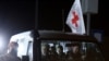 A Red Cross vehicle, as part of a convoy believed to be carrying hostages abducted by Hamas militants (REUTERS/Ibraheem Abu Mustafa)