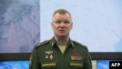 This video grab taken from a handout footage released by the Russian Defence Ministry on April 23, 2022, shows Russian Defense Ministry spokesman Major General Igor Konashenkov holding a briefing. 