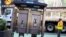 A worker removes the last public payphone near Times Square in New York City, May 23, 2022. 