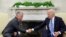 FILE - U.S. President Joe Biden shakes hands with Jordan's King Abdullah in the Oval Office at the White House in Washington, July 19, 2021. 