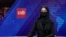 FILE - TV anchor Khatereh Ahmadi reads the news on TOLO NEWS, in Kabul, Afghanistan, May 22, 2022. The Taliban government suspended, April 16, 2024, the broadcast of two privately run local TV channels over alleged violations of official regulations and “Islamic values.”